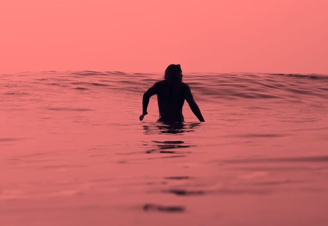 Riding a small wave on the point near Tamraght